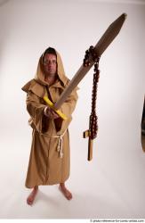 JOEL_ADAMSON STANDING POSE WITH SWORD AND CRUCIFIX